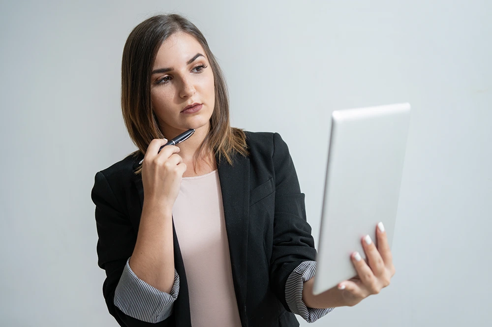 Make-Smarter-Business-Decisions-img Woman smiling while holding a mobile phone